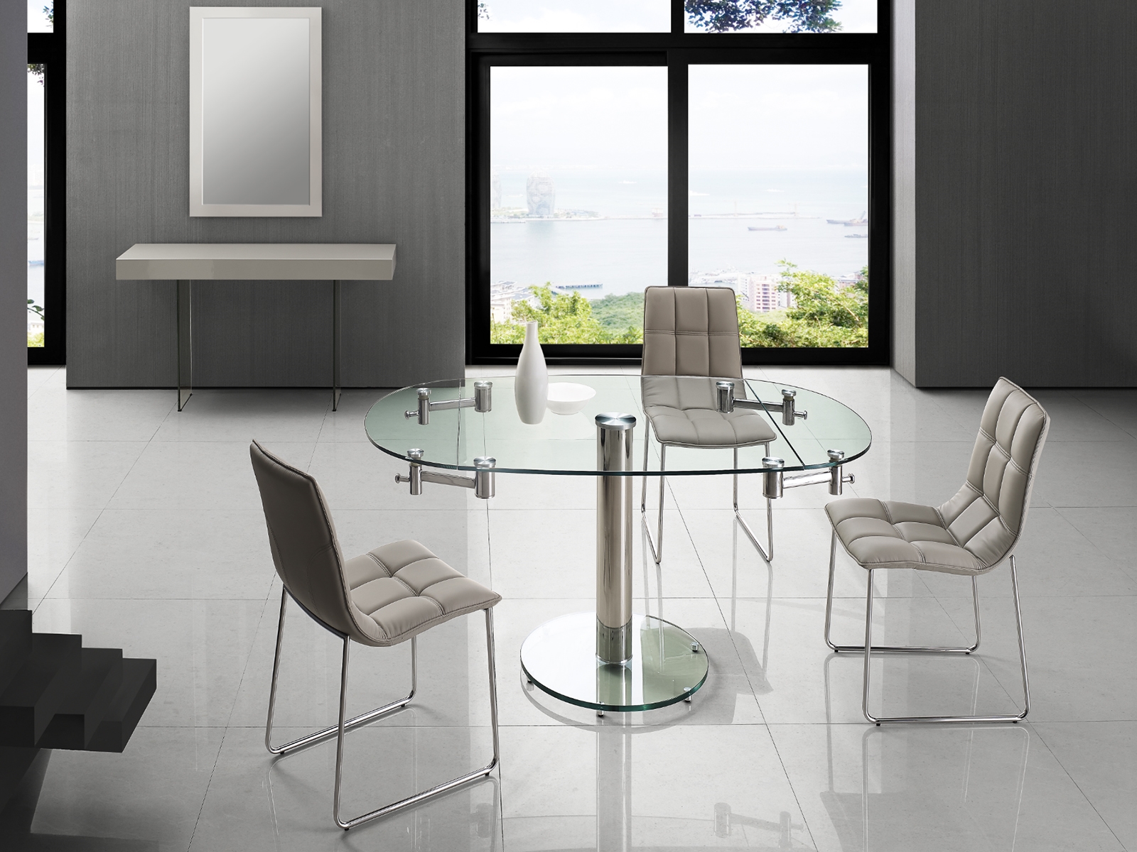 Thao manual dining table with stainless base and clear top.